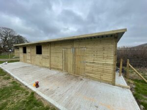 24x12 double stable front - 16x12 double door store room